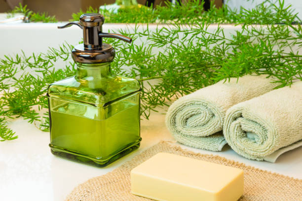 istock Bottle with liquid soap, bar soap, towels on bathroom counter 639628298