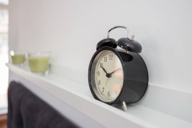 istock Alarm clock on a shelve 639628782