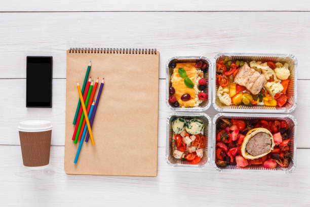 istock Healthy food, lunch in foil box on student table, diet 639628926