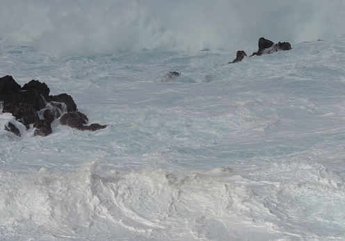 Blustering surf at a rocky coast.