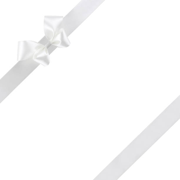 istock White silk ribbon with bow isolated on white background 639632276