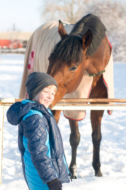 istock Boy and horse 639633040