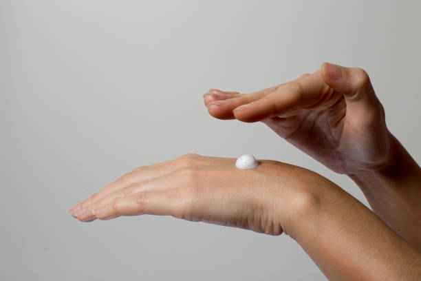 istock woman hand cream isolated 639633204