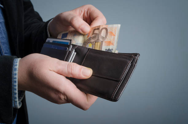 istock Man gets money from the wallet. Selective focus. 639635374