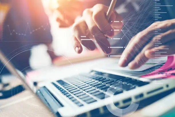 Photo of Typing on laptop close-up. Man working on computer