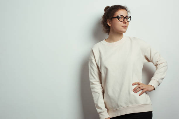Portrait of charming woman hipster wearing blank sweater stock photo