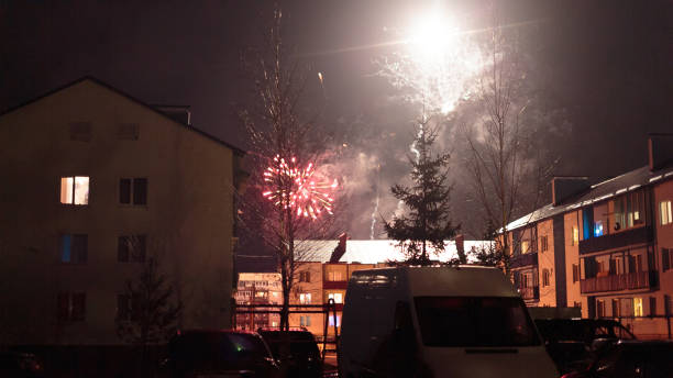 istock fireworks in the night sky over houses 639640974