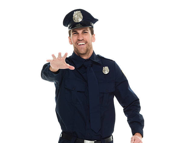 istock Smiling police waving hand 639643108