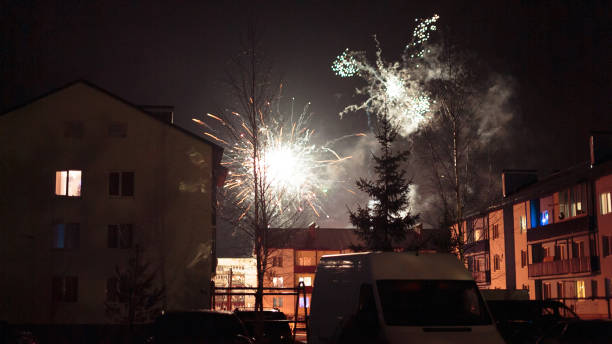 istock fireworks in the night sky over houses 639643184