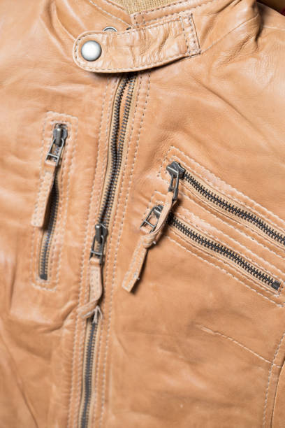 istock Light brown leather jacket. Beige color leather jacket on hanger 639643358