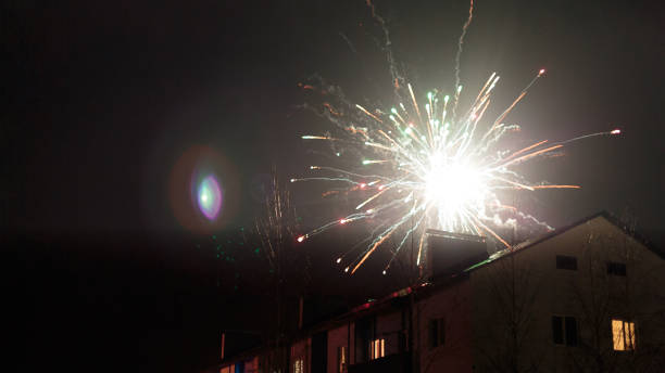 istock fireworks in the night sky over houses 639644034