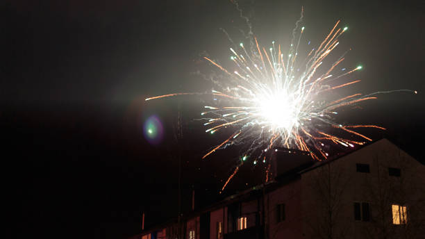 istock fireworks in the night sky over houses 639644138