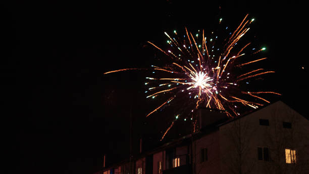 istock fireworks in the night sky over houses 639644238