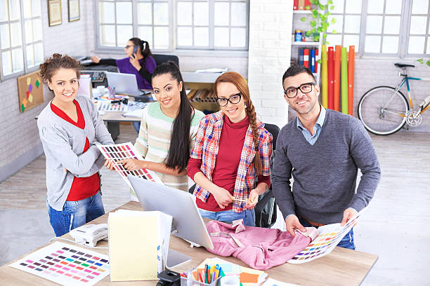 istock Team of young people in workplace, looking at camera 639644544