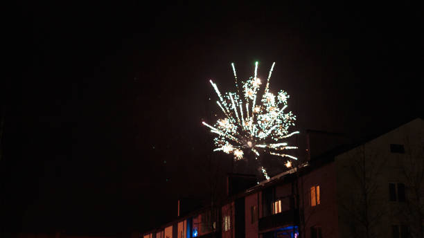 istock fireworks in the night sky over houses 639647162