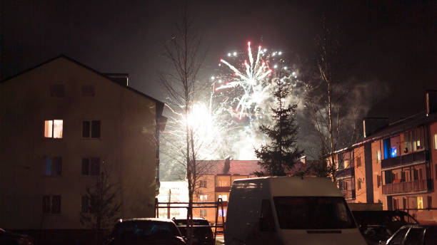 istock fireworks in the night sky over houses 639647498