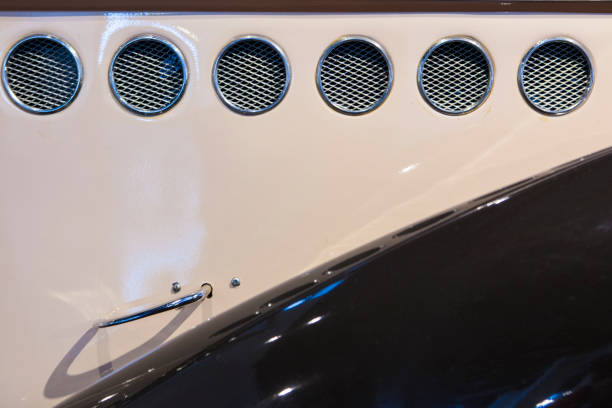 Side circular grilles detail on classic car