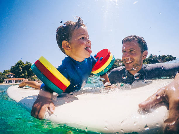 istock Surfer and his boy 639649260