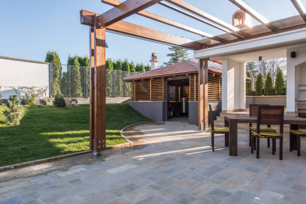 istock Long table and chairs on veranda in luxury villa exterior 639650100