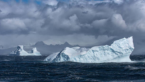 istock Two massive Icebergs floating in Antarctica 639651654