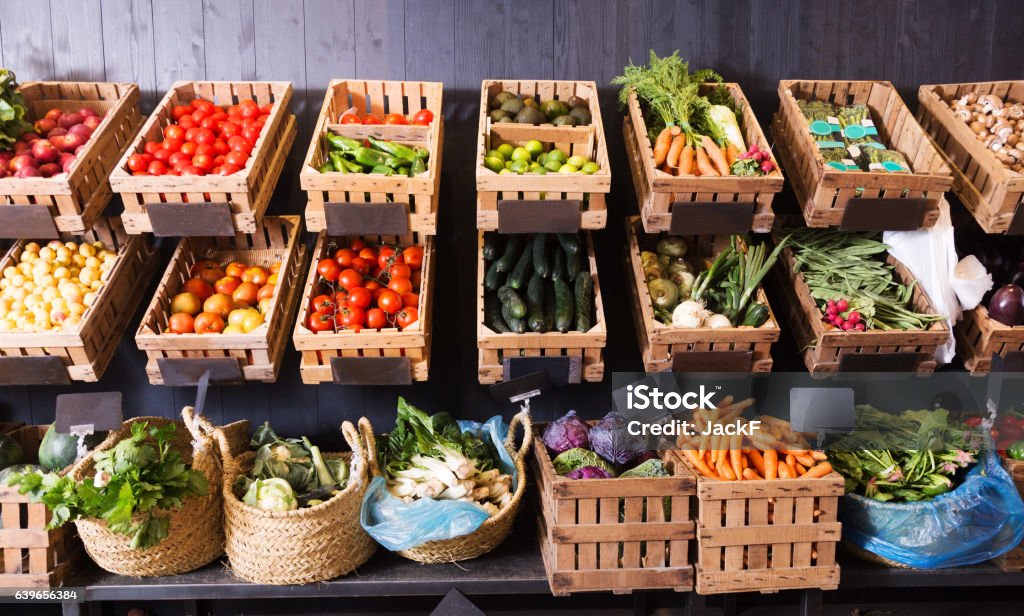 fruits and vegetables shop many different fresh fruits and vegetables in baskets on food market Vegetable Stock Photo