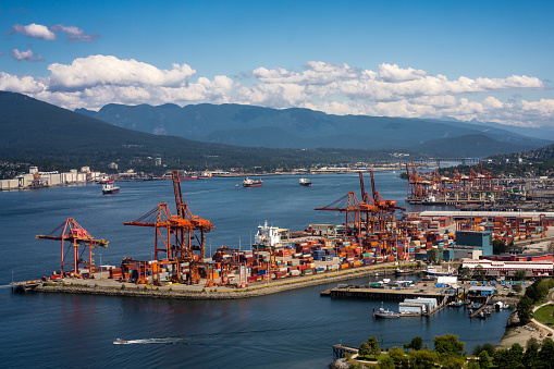 The Port of Vancouver lies along the Burrard Inlet with the North Shore Mountains in the background. 