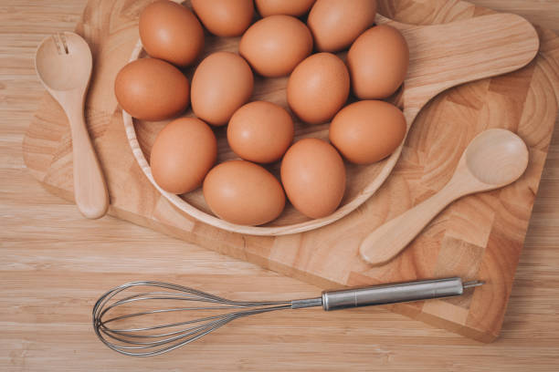 istock Eggs in wooden dish with wooden Spoon and fork 639662606