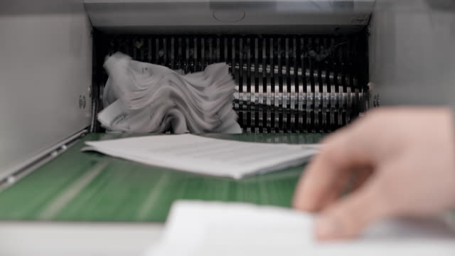 TU Shredding machine destroying documents