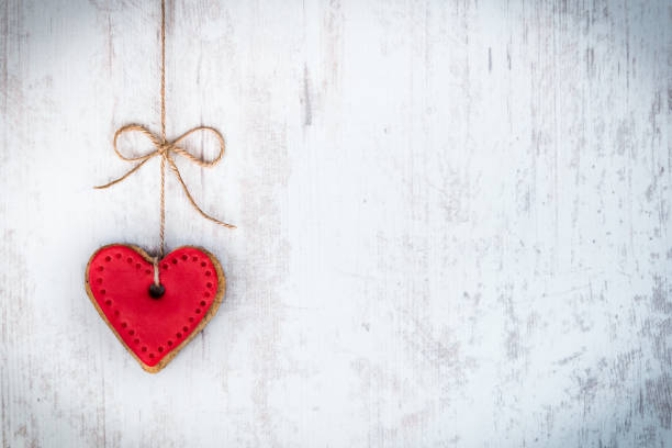 istock Valentines day concept. Heart shaped cookie tied with hemp bow. 639663930