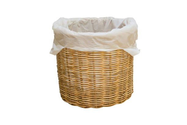 istock Empty wicker basket with plastic bag isolated on white 639667686