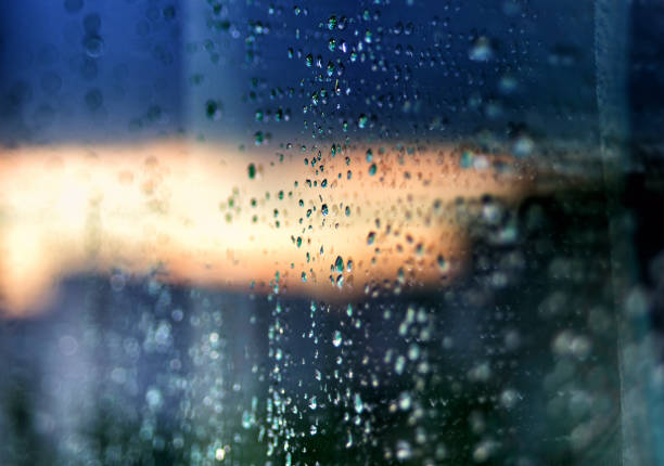 Raindrops on glass abstract background