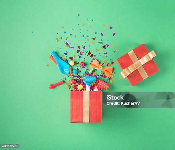 Gift Box With Party Confetti Balloons Streamers Noisemakers Stock Photo - Download Image Now