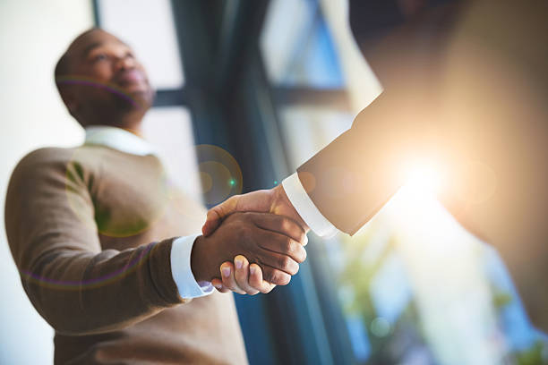 Great things can only be achieved together Closeup shot of two businessmen shaking hands in an office business handshake stock pictures, royalty-free photos & images