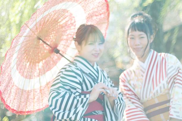 istock Women in kimono with umbrella 639678866