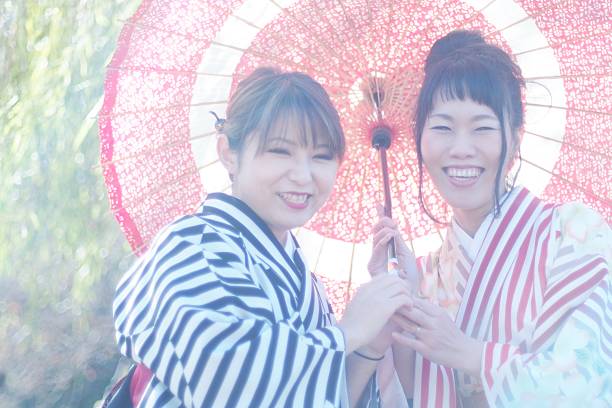istock Women in kimono with umbrella 639678974
