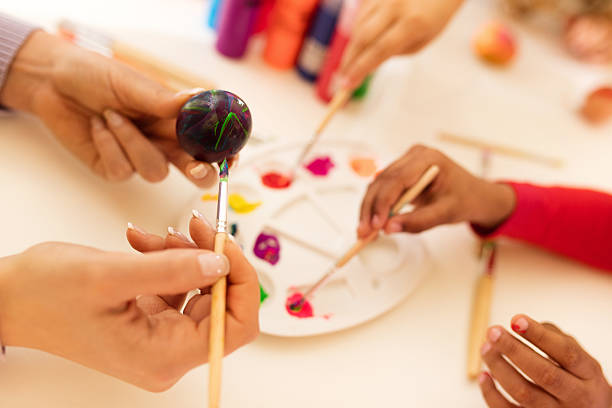istock Close up of coloring Easter egg with watercolors. 639679176