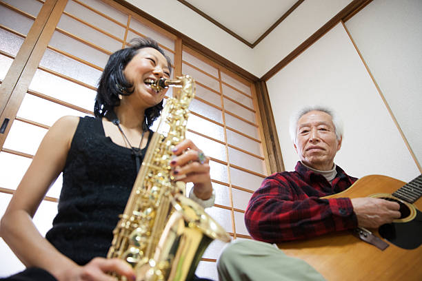 elderly japanese people enjoying music big smile - hoby imagens e fotografias de stock
