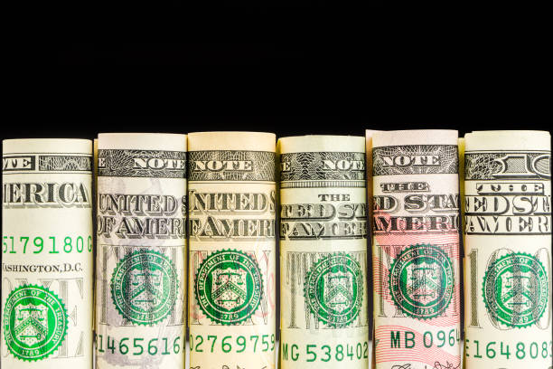 istock rolls of american dollar banknotes in one row 639685302