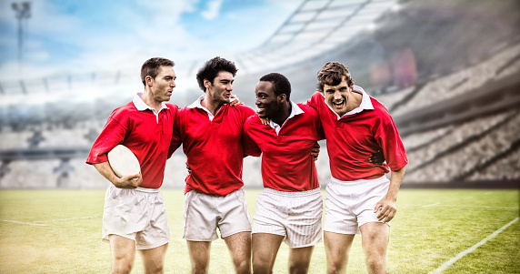 Rugby fans in arena against rugby players smiling with arms around 3d