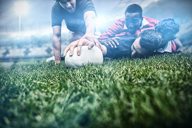 Rugby fans in arena against rugby players tackling during game 3d