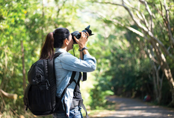 istock Professional woman photographer taking 639687508