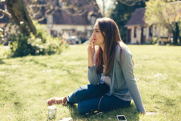 Young girl smoking cigarette