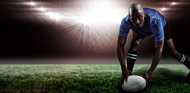 istock Composite image of rugby player holding ball 639687600