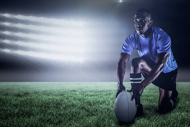 istock Composite image of rugby player holding ball 3d 639687700