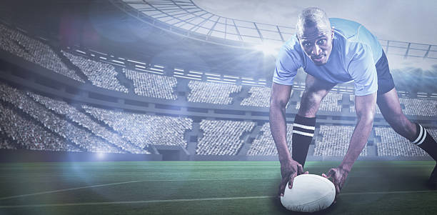 istock Composite image of rugby player bending and holding bal 3d 639687848