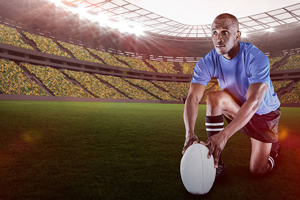 istock Composite image of rugby player holding ball  with 3d 639687940