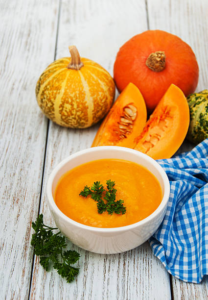 istock Pumpkin soup with fresh pumpkins 639689268