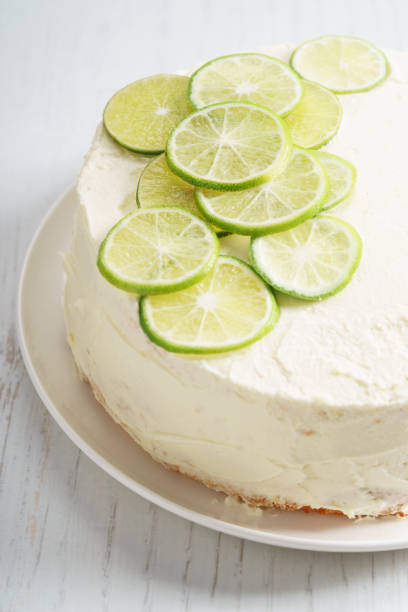 istock sweet white buttercream cake with sliced lime on top 639689722