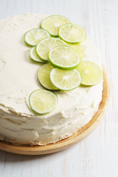 istock sweet white buttercream cake with sliced lime on top 639689782