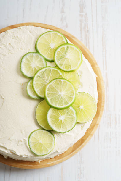 istock sweet white buttercream cake with sliced lime on top 639689850